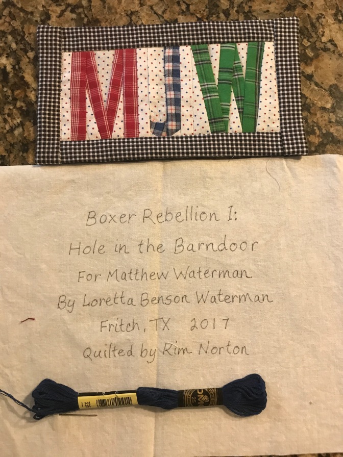 Matthew labels on back of quilt